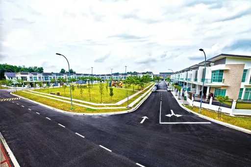 A landscaped street of double-storey terrace homes at Taman Cheras Idaman 2.