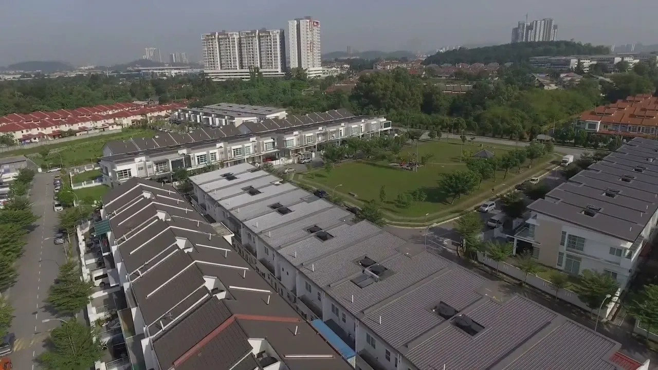 A wide aerial over the Taman Cheras Idaman township toward the surrounding neighbourhood skyline